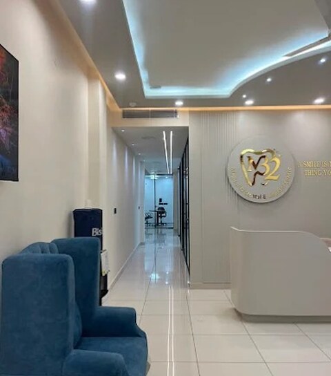 The reception and waiting area at Magical 32, with the clinic's gold signage